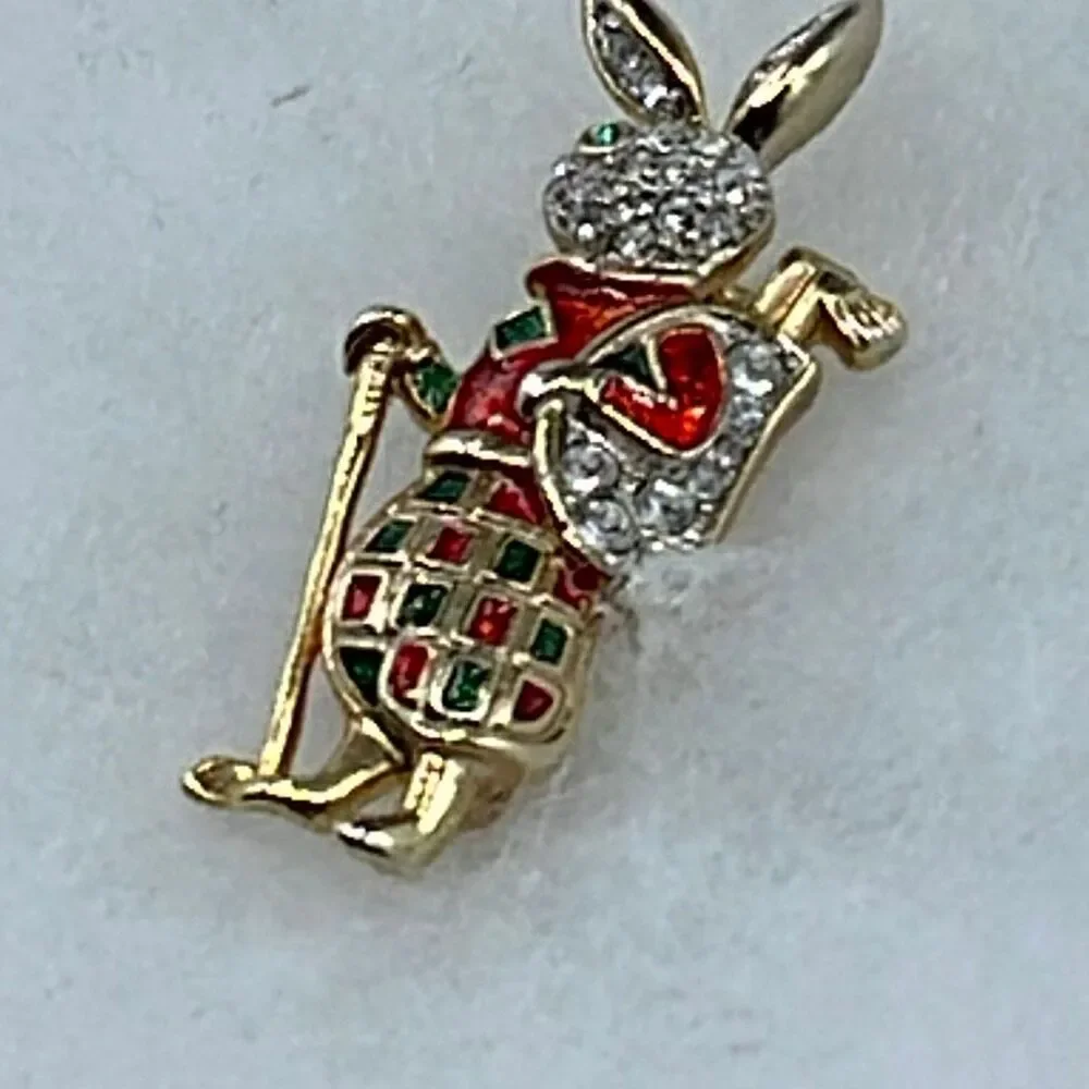 Vintage rhinestone enamel bunny tartan plaid golfer brooch.